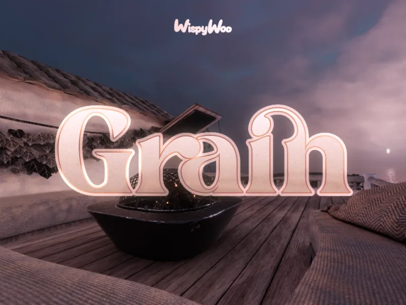 木のデッキの上の焚き火台とクッション付きの座席の上に、「grain」のタイトルが出ている。
